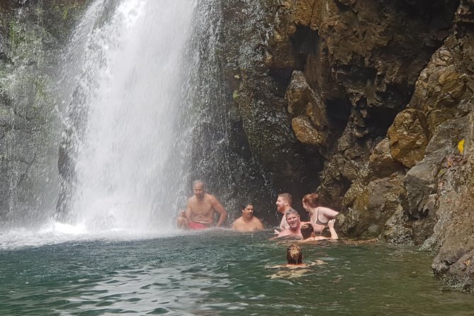 River Tubing Fiji, Navua River - Swimming beneath the waterfall